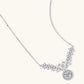 Elegant sterling silver necklace featuring intricate wing-like design with brilliant moissanite stones on neutral background.